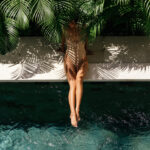 young black woman relaxing at spa pool.
